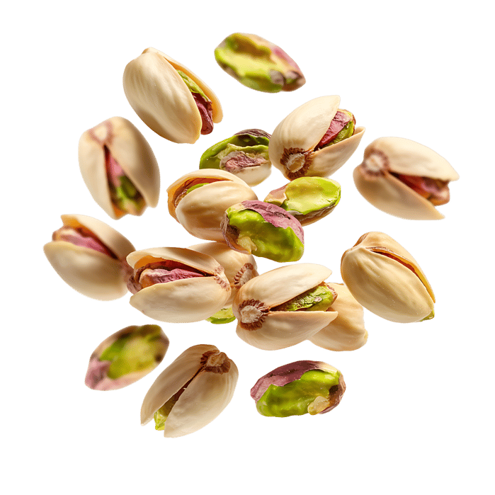 Falling pistachios, isolated on white background