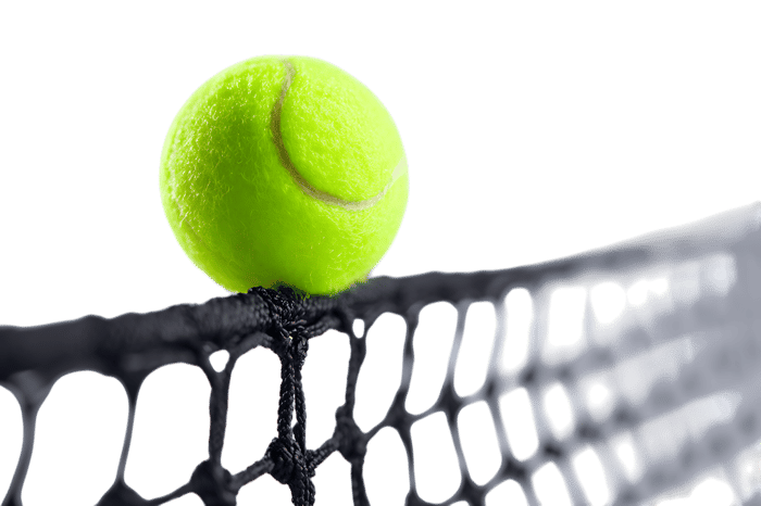 Close up of tennis ball on racket strings ready for action
