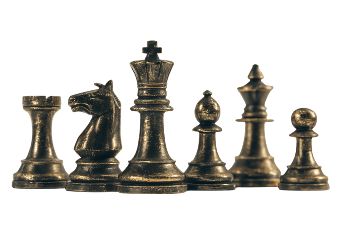 Close up of dark chess pieces on black background