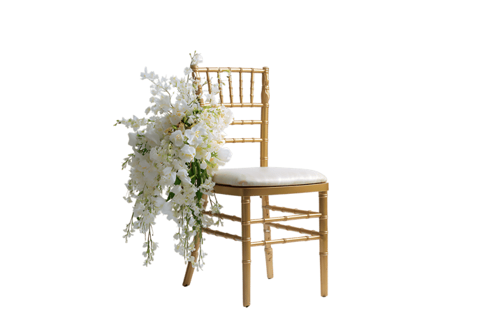 Gold chiavari chair decorated with white flowers for wedding or event