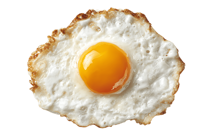 Close up of a perfectly fried egg with a runny yolk.