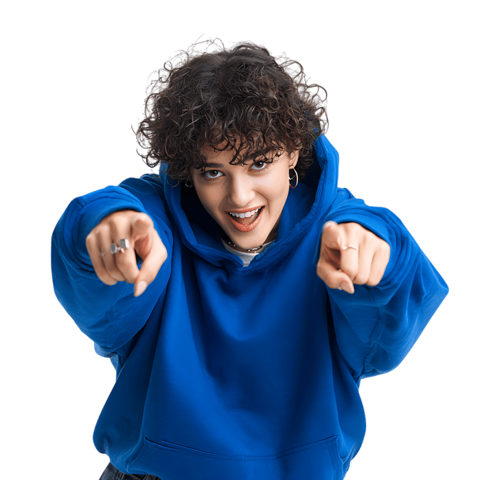Smiling woman in blue hoodie pointing her fingers at you. I want you! Hey you!