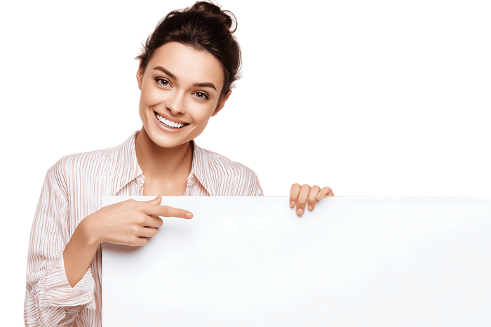 Smiling woman pointing at blank sign.  Perfect for advertisement981.