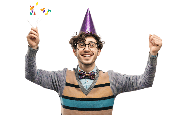 Happy man celebrating with party hat and confetti