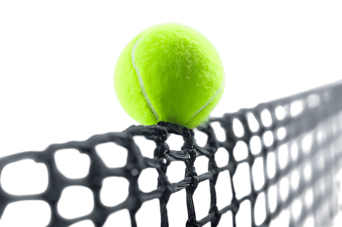 Close up of tennis ball hitting racket strings