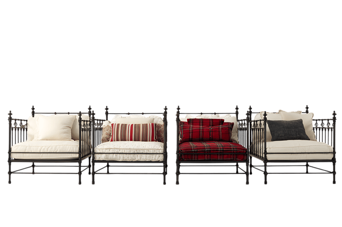 Four metal chairs with various colored cushions.