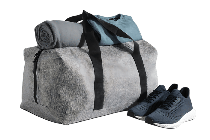 Grey duffel bag with teal shirt rolled-up blanket, and navy sneakers
