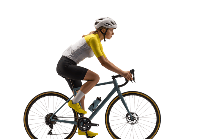 Female cyclist riding a bicycle in sportswear and helmet