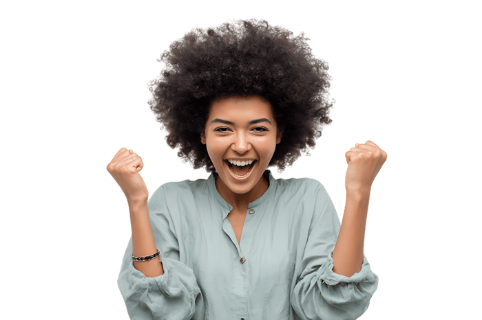 Happy woman celebrating success with a big smile and raised fists.