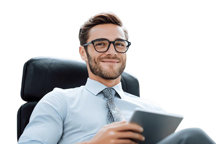 Confident businessman using tablet in office chair
