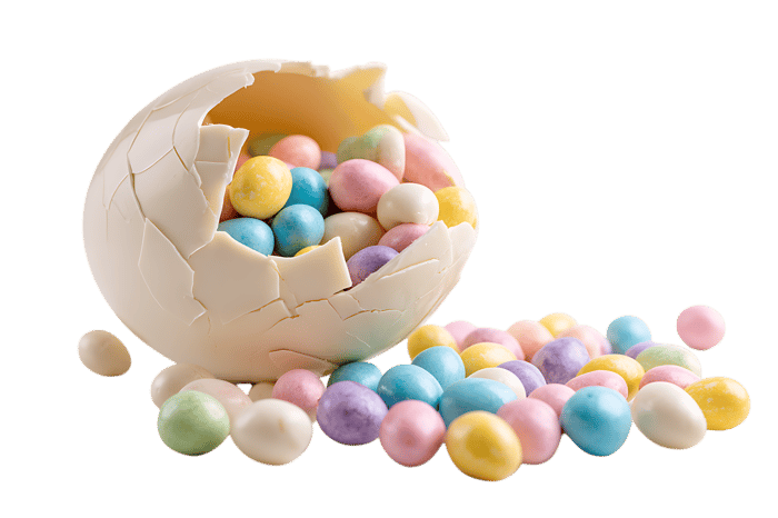 Pastel candy spills from a cracked white chocolate egg.