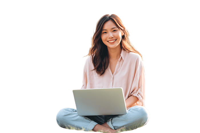 Smiling woman working on laptop outdoors