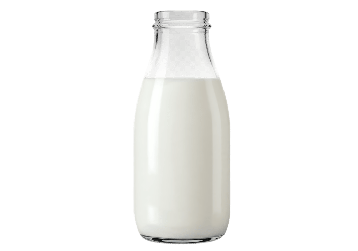 Glass bottle filled with fresh milk.