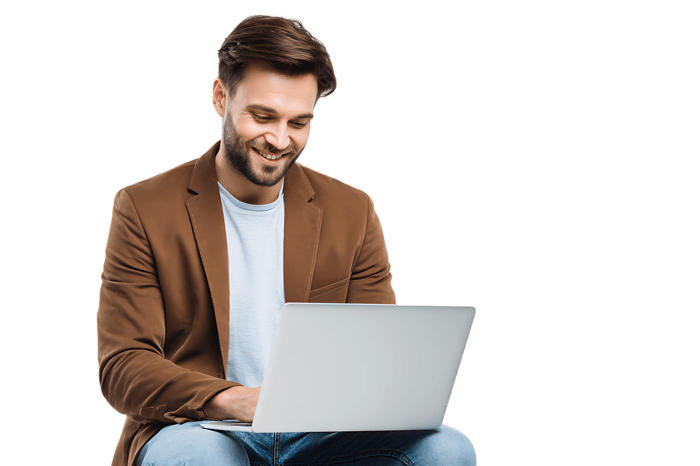 Smiling man working on laptop