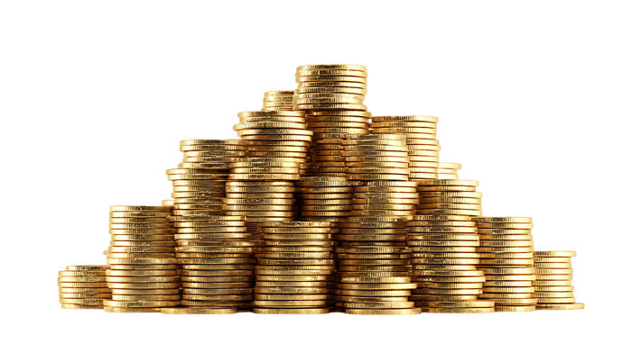 Golden coins stacked high, wealth concept