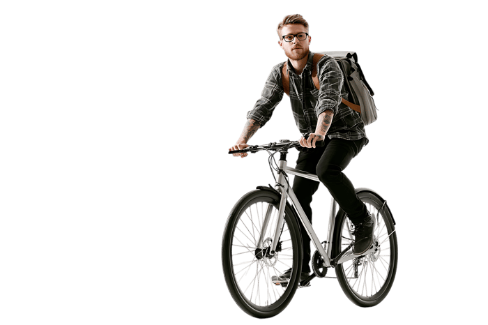 Stylish man riding a bicycle in the city.