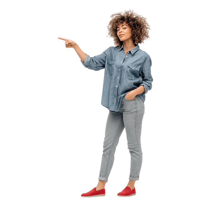 Stylish woman pointing towards copyspace, showcasing confidence.