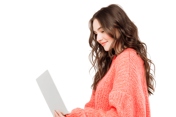 Young woman using a laptop, smiling.