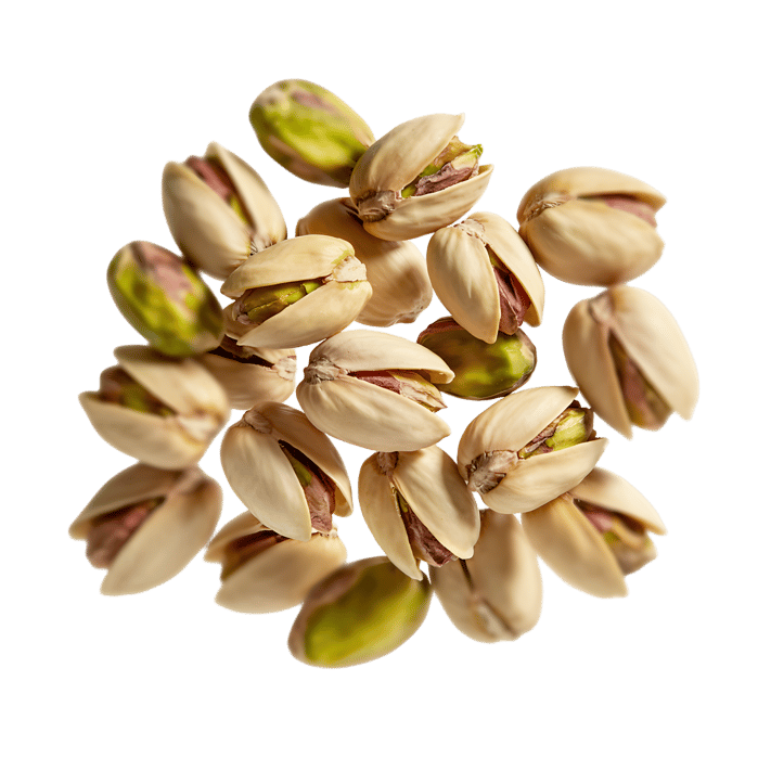 Pile of roasted pistachios, shelled and ready to eat.