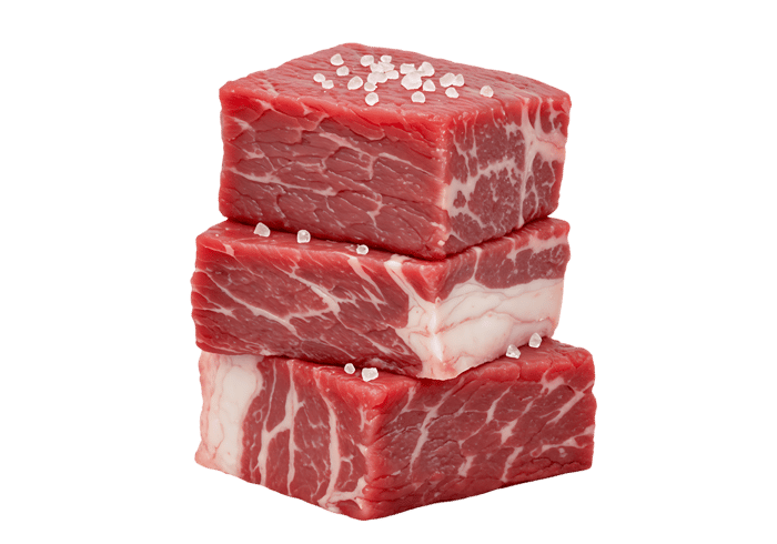 Three raw beef cubes, seasoned with salt.