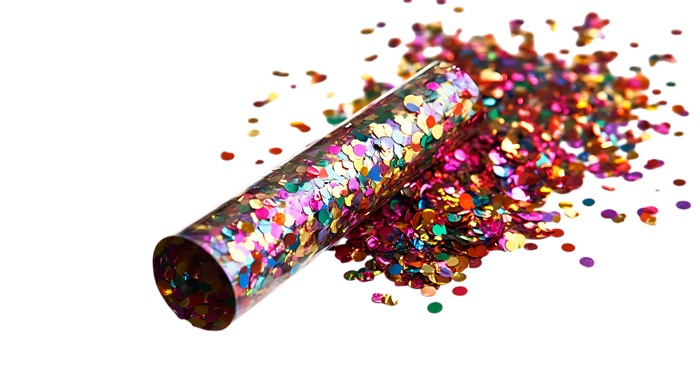 Colorful confetti exploding from a tube