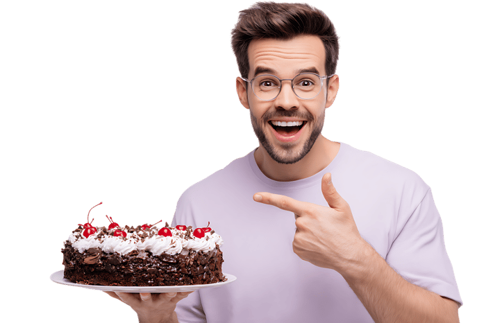 Man excitedly shows off delicious cake.