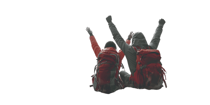 Two kayakers raise arms in victory after reaching their destination.