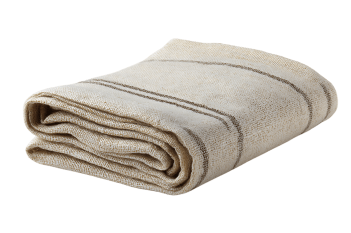 Cream colored folded throw blanket with subtle stripes