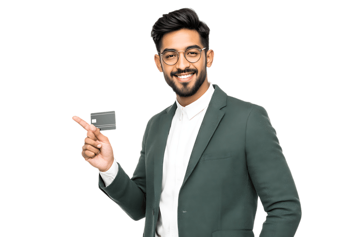 Smiling businessman holding and pointing at a credit card.