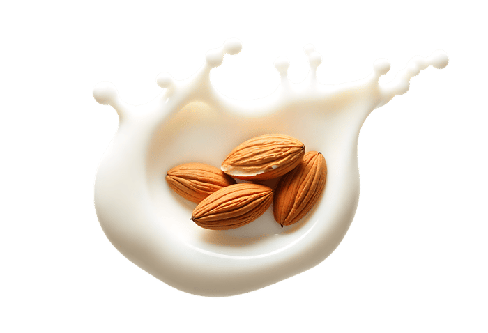 Whole almonds creating a splash in creamy milk, showcasing dairy alternative and healthy snack concept