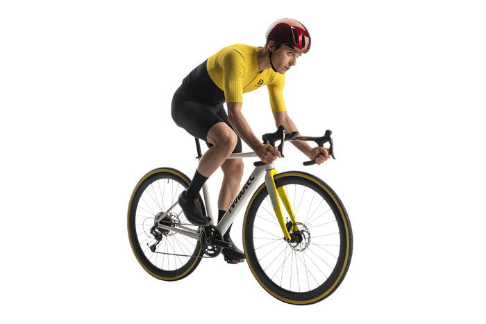 Male cyclist riding road bike in racing gear and helmet
