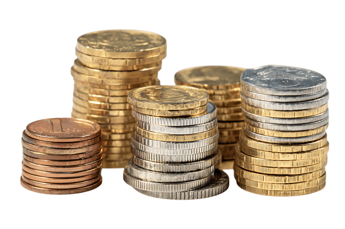 Various coins stacked high, representing wealth, finance, and savings.