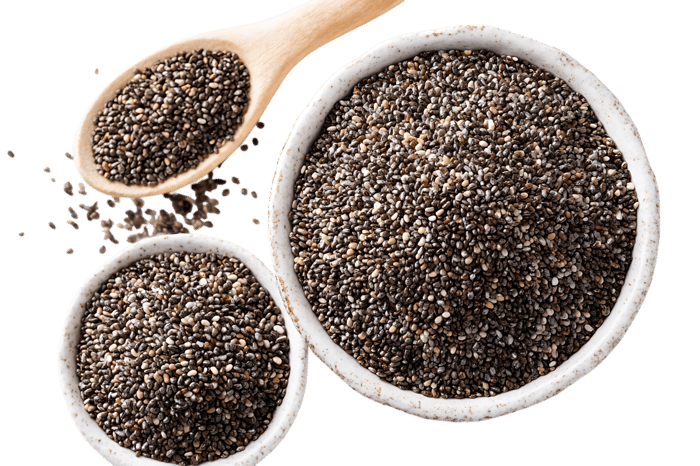Chia seeds in bowls and wooden spoon. Healthy food concept.