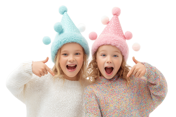 Two girls in festive hats point at themselves.