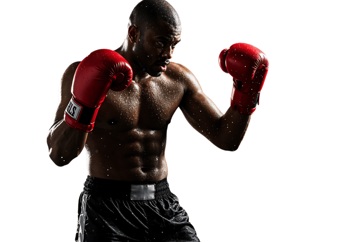 Powerful boxer in action muscles flexed red gloves