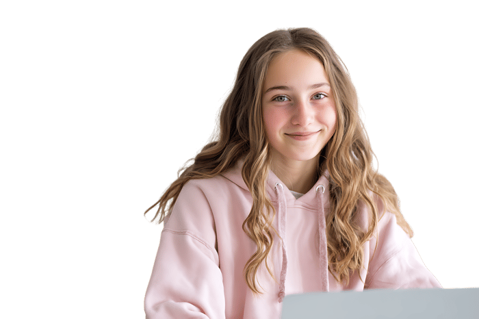 Smiling teenage girl using a laptop.