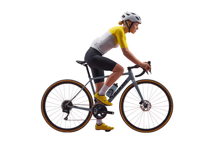Female cyclist riding a road bicycle, isolated