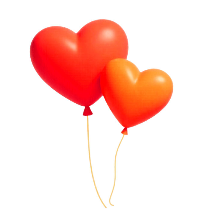 Two heart shaped balloons floating in the air