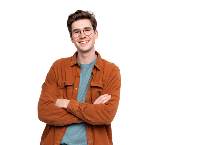Happy young man smiling with arms crossed, isolated on black background.