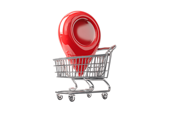 Red map pointer in shopping cart.  Online store location, delivery concept.