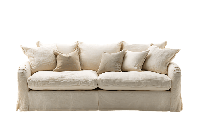 Comfortable cream colored sofa with soft cushions