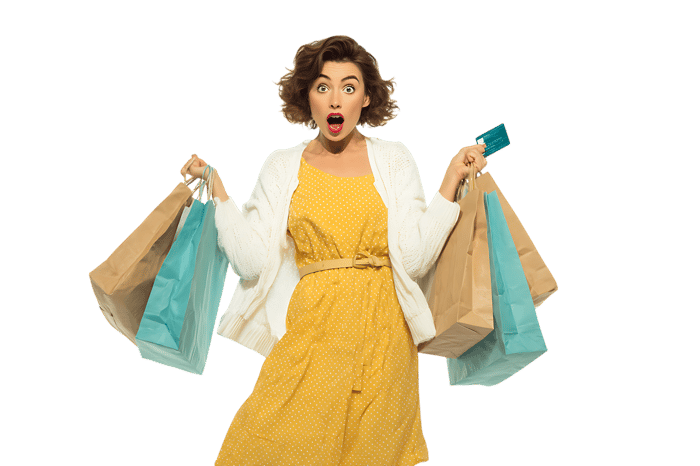 Surprised woman with shopping bags and credit card