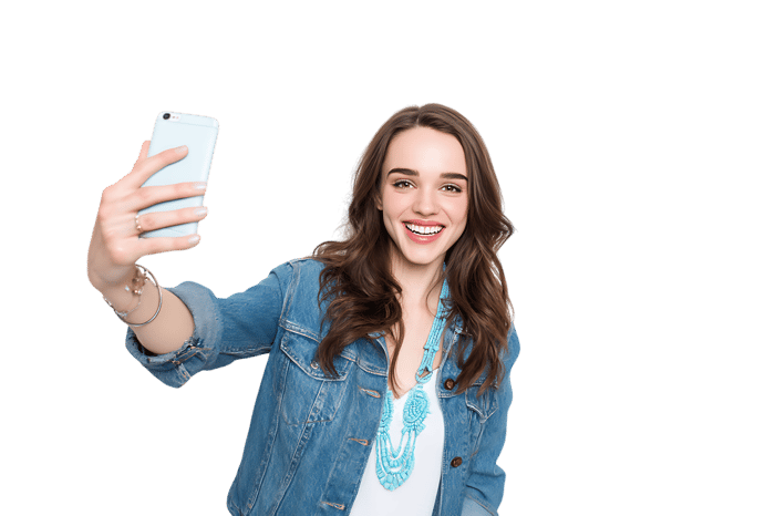 Happy young woman taking a selfie with smartphone