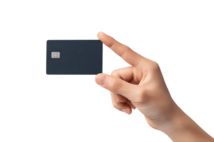 Close up of a hand gesturing towards a black credit card.