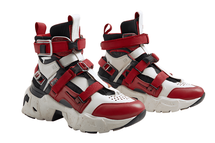 Stylish red and white high top sneakers isolated on black.