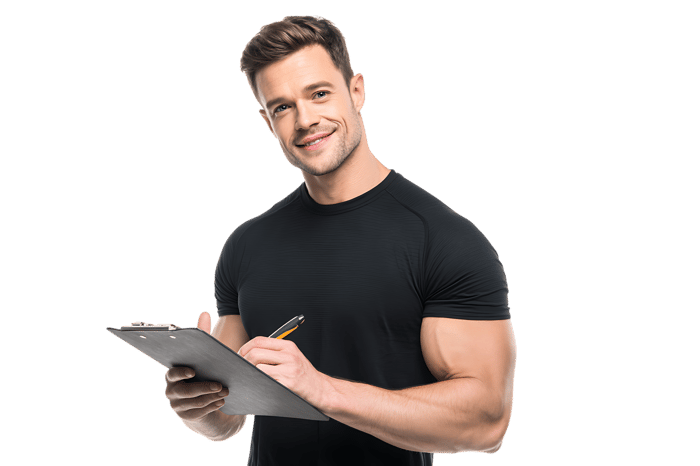 Smiling fitness trainer writing on clipboard