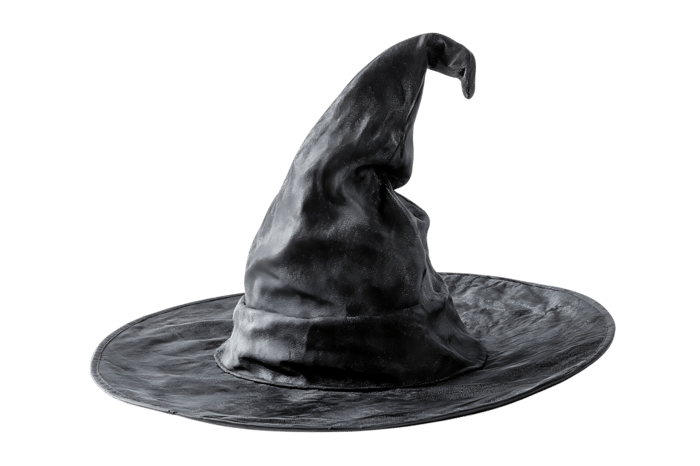 Close up of a classic witch's hat, isolated on black.
