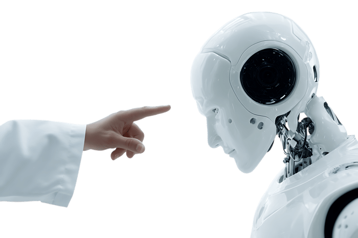 Human hand pointing at a robot's head.