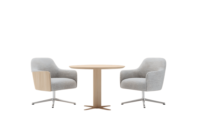 Two modern armchairs and a small round table.