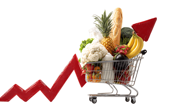 Rising food prices concept. Shopping cart overflowing with groceries and a red arrow pointing upwards.